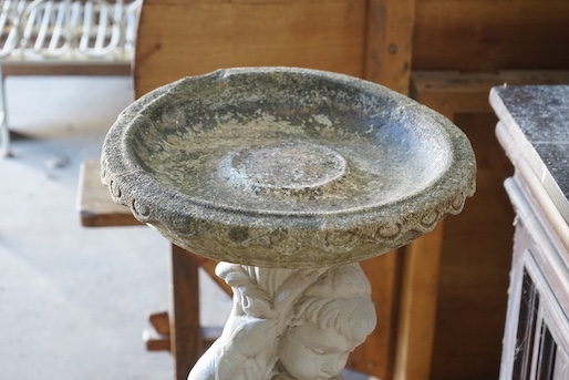 A reconstituted stone figural garden bird bath, height 89cm